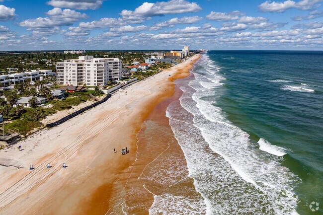 Residents cross the Granada Bridge to hang out on the coast of Ormond Beach.