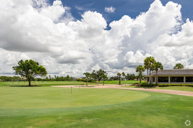 Estero Country Club at The Vines features a golf course, clubhouse, and practice areas.