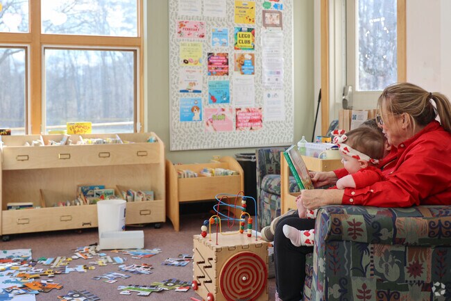 Children enjoy the play area at the Newbury Library.