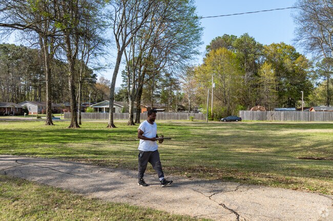 Experience the serene beauty of Hancock Park in Tupelo, where scenic walking paths invite you to explore the lush landscapes.