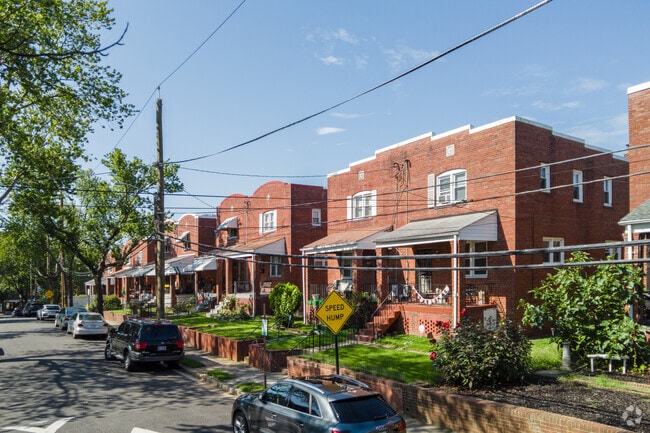 Semi-detached brick row can sometimes sit on elevated lots along Benning Heights streets.