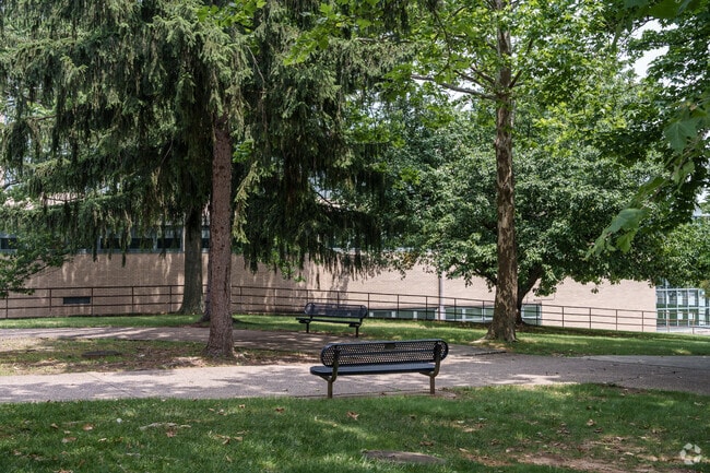 Shaded paths with many benches course throughout Cardinal O'Hara High School's campus.