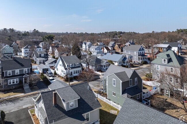 Various homes of different styles site next to each other nestled on the residential streets of Green wood.