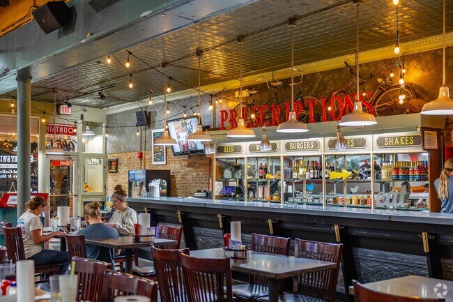 Stop in to see Swaney Swift's vintage interior with Prescription signs and unique bar.