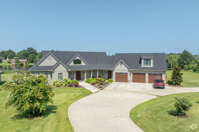 Admire this french country style home in Forest Lake,