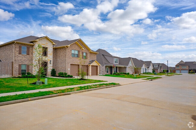 The new homes in Lumberton feature large garages.