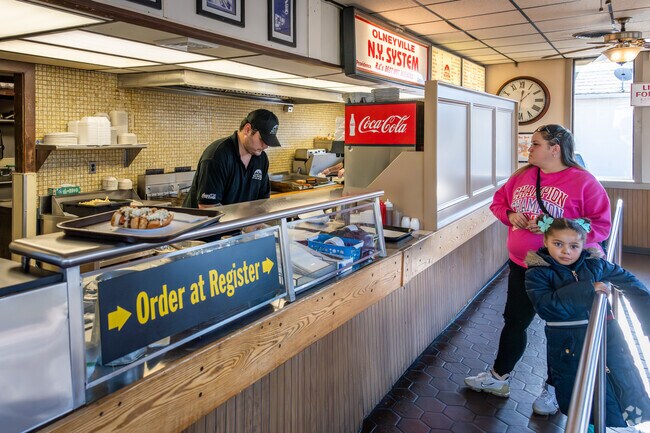 Treat yourself to the iconic hot dog weiners at Olneyville NY System in Eden Park.