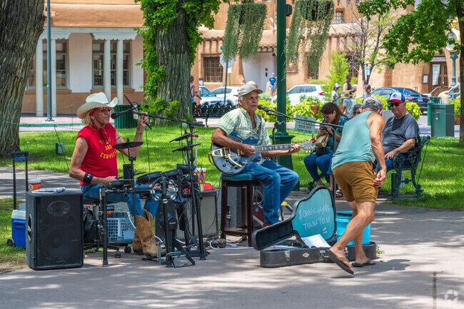 Musicians fill the cool, mountain air with music at the events of Santa Fe Plaza near Tres Arroyos.