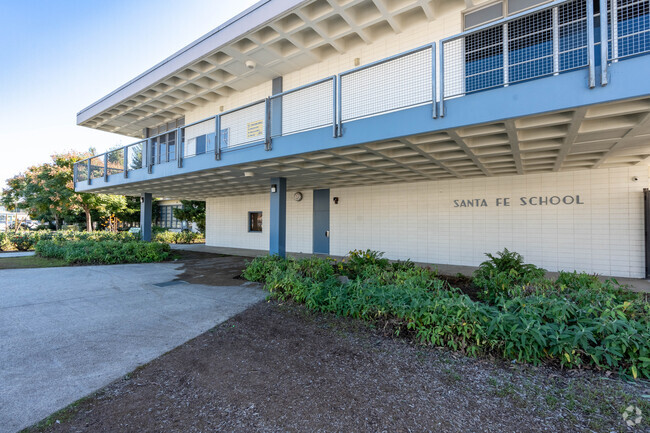 Sidewalk view of Santa Fe Computer Science Magnet School.