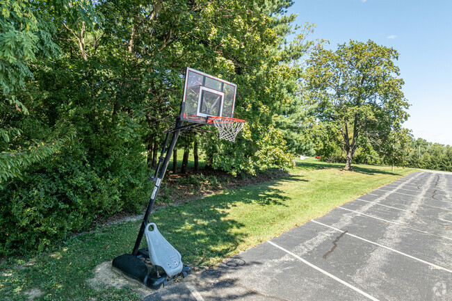 The Pleasant Hill parking lot converts to a multi-purpose activity are with a basketball hoop.