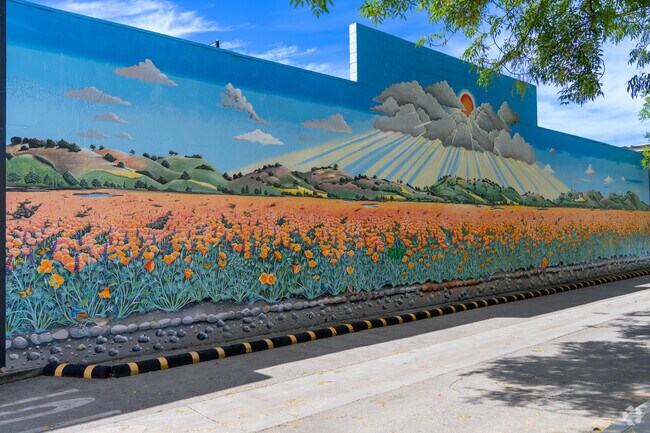 Located near Ventura, the Under the Sun mural by Mohamed Soumah brings life to California Avenue with its sweeping floral landscape.