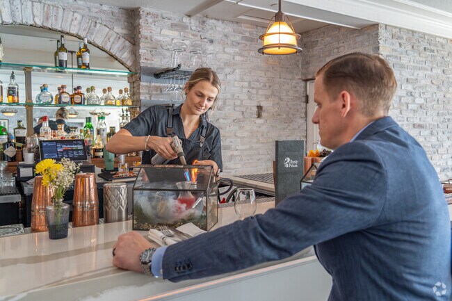 Explore fine dining and cocktails at Rusty Pelican at Rocky Point.