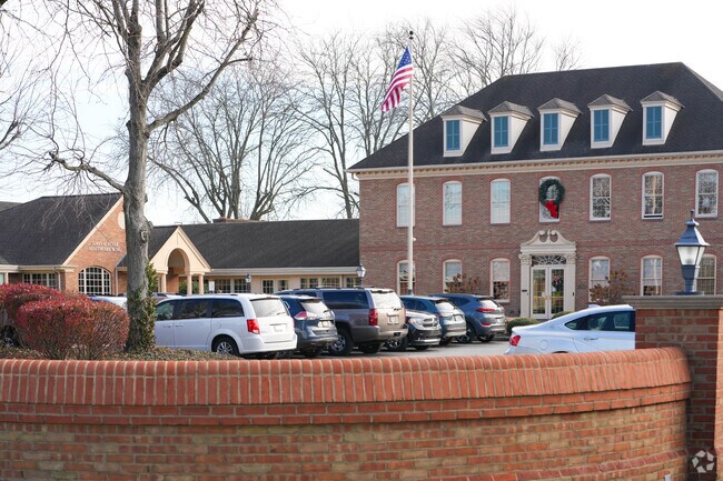 The Preparatory School shares a large building with other businesses located within it.