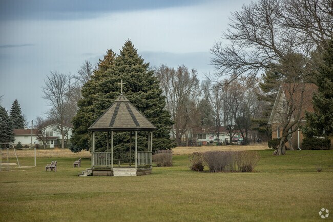 St. Paul school has a small grassy area out back with pergola for shade.