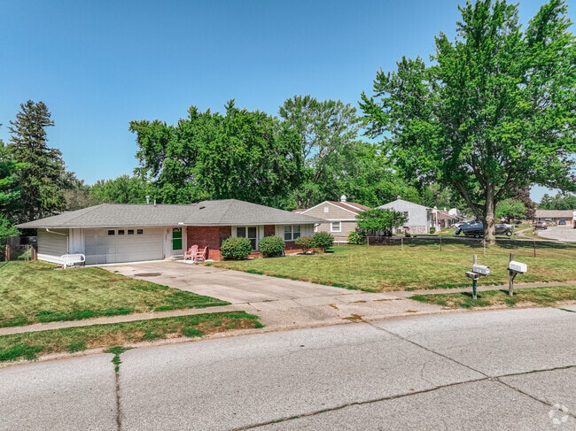 A row of mid-century ranches lines a street in Vinton Woods, Kokomo.