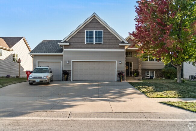These Craftsman-style homes in Hart Farms offer inviting designs and ample driveway space.