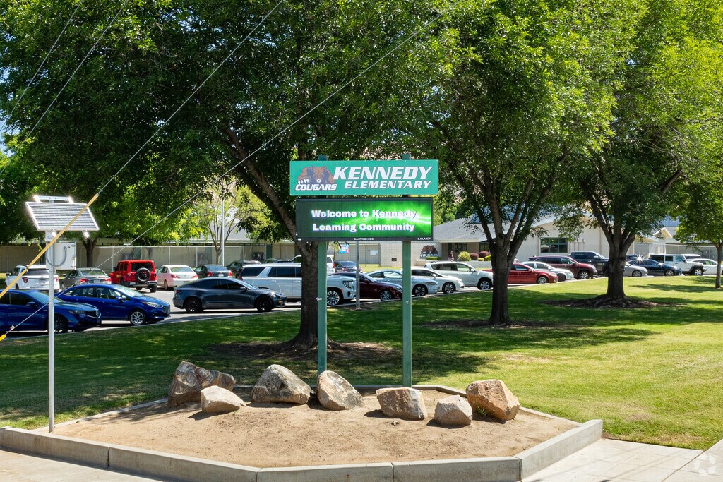 A lighted marquee at the entrance to Kennedy Elementary School informs parents of events
