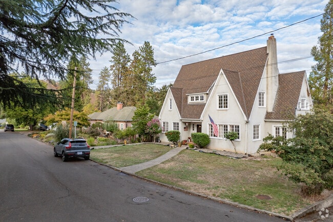 A Gothic Revival home shares the block with smaller national-style homes in Laurelwood.