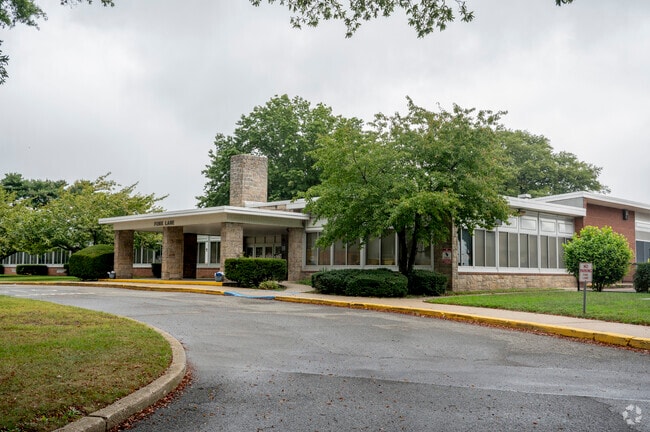 Fork Lane School is surrounded by trees and greenery in Hicksville, NY,