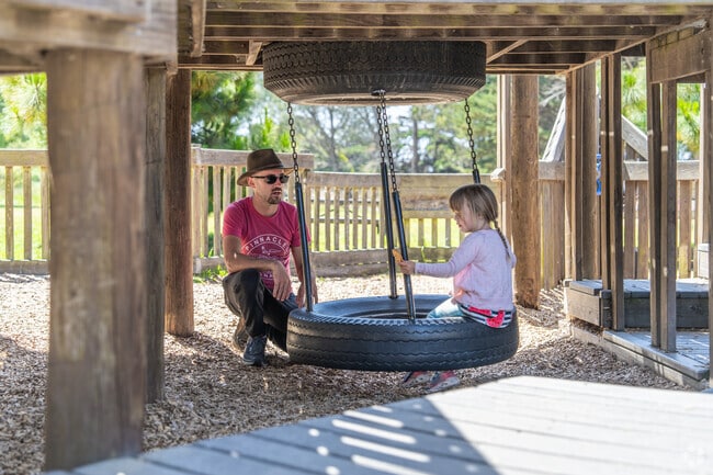 Dreamland for Kids Playground in West Berkeley has play structures and tire swings to explore.
