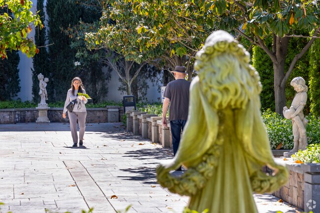 Adams Hill locals browse the statues and art at Forest Lawn Cemetery's museum.