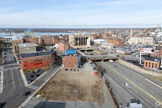 The Fall River City Government building sits above the Interstate 195 highway.