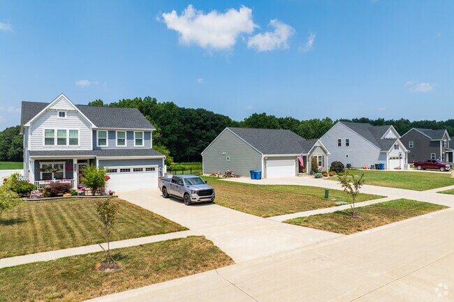 Multi-car garages and wide sidewalks define this new residential development in Grafton.