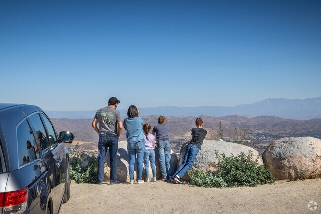 A Family pulls over at Lookout Roadhouse in the La Cresta area to check out the view.