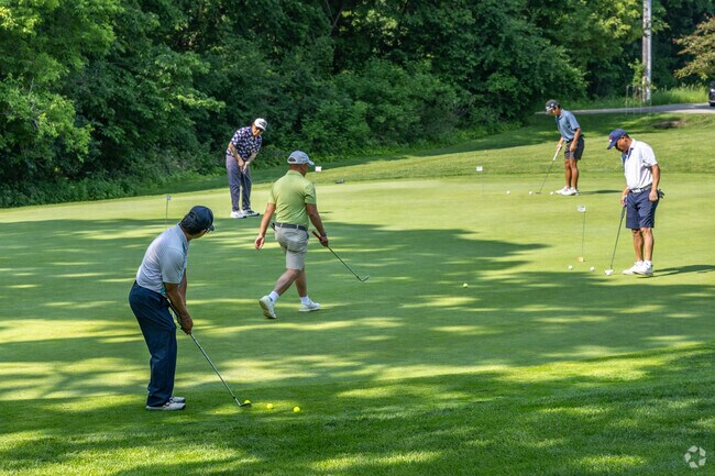 The putting green at Ravenna's Hidden Greens Golf Course is always a busy place.
