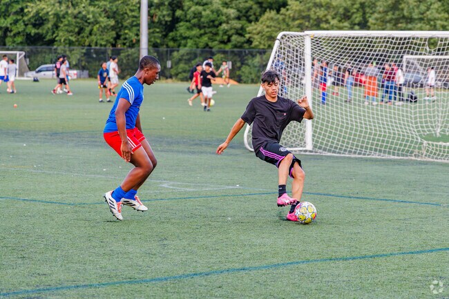 Mates from Lamrocton challenge each other in a pickup game at Smith Soccer Complex.