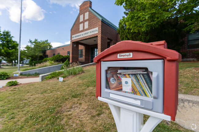 A free little library sits outside of Dr. Norman W. Crisp Elementary School.