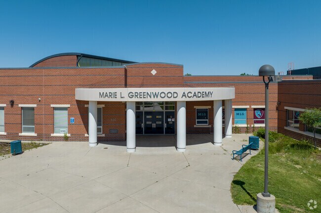 Marie L. Greenwood Academy welcome sits students through its doors.
