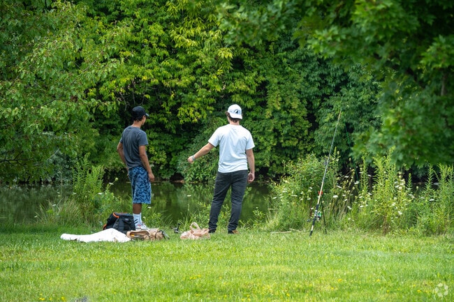 The residents of Westbend neighborhood enjoy fishing and picnicking by the pond.