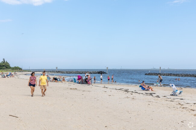 Residents of Mystic Island visit Graveling Point Beach for sunbathing.