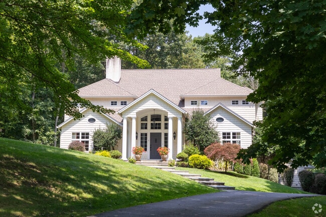The charm of yesteryears meets contemporary flair in Bedford's Classical New Traditional home.