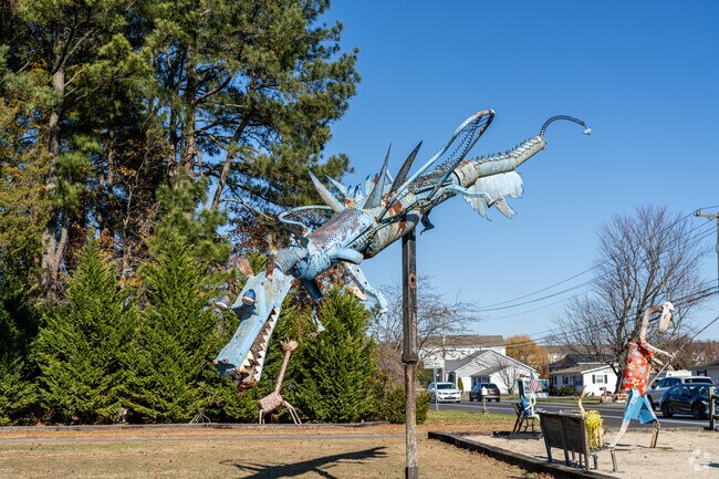 A whimsical dragon sculpture greets visitors to The Peninsula.