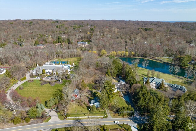 Tree‑lined lanes and large lots characterize Saddle River’s landscape.