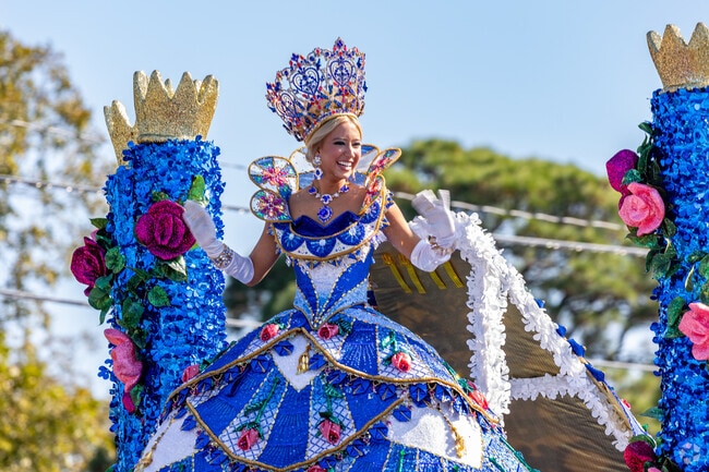 The Texas Rose Parade's new Tyler Rose Queen for 2024 waves excitedly to the people of Tyler.