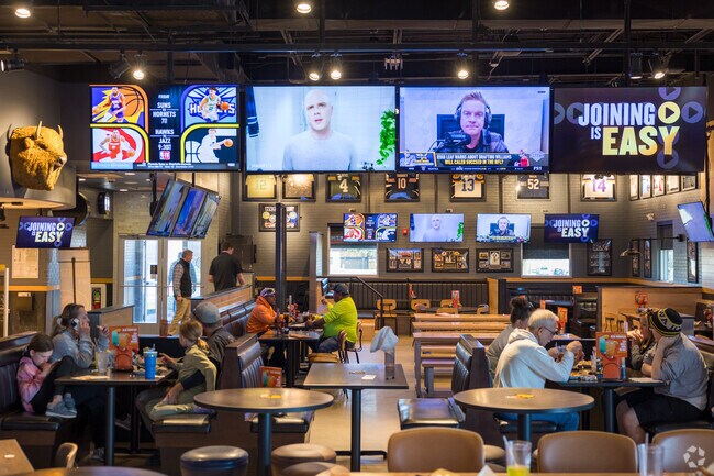 Buffalo Wild Wings on Merle Hay Rd serves up tasty wings alongside many TVs for the big games.