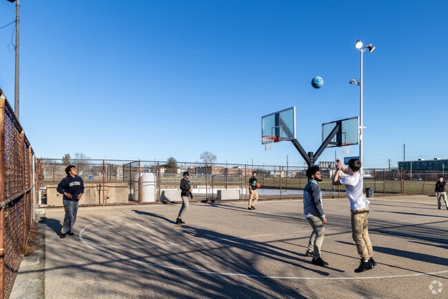 Playing basketball with friends at American Legion Playground.