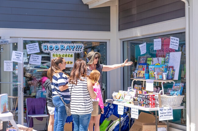 A local vendor showing different items to her customers in the Day Valley area.