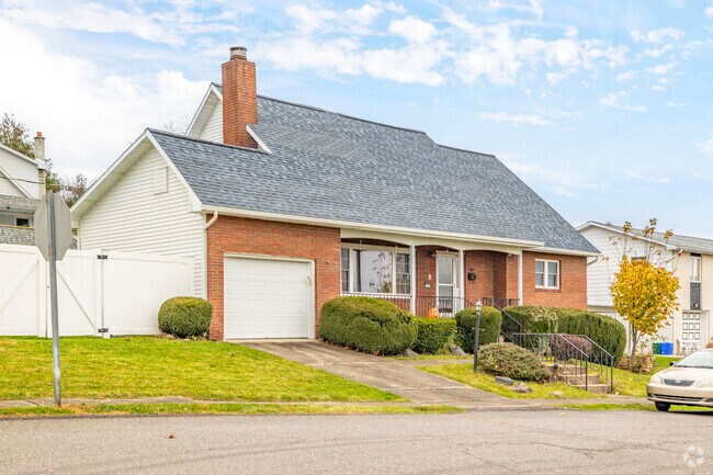 Live in a beautiful brick façade craftsman style home in Old Forge, PA.