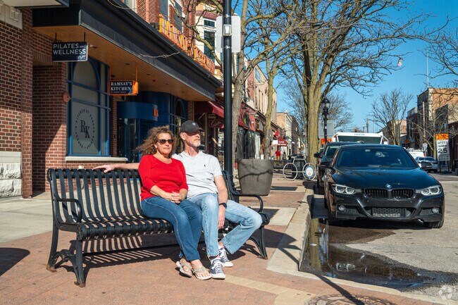 A Naperville couple enjoy a warm early evening in Downtown Naperville.