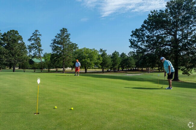 Goshen Golf Course near Hancock Mill offers a sprawling 7,400-yard layout with lake views.