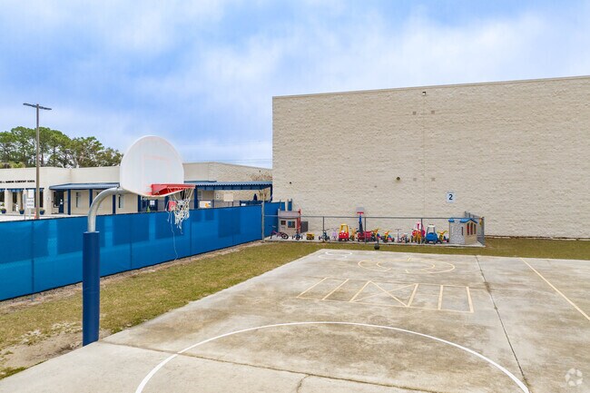 Kids enjoy outdoor play on the sports courts at Hammond Elementary.
