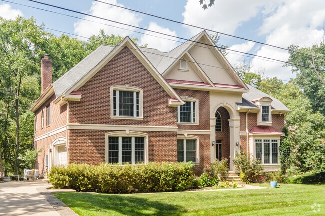 Brick two‑story homes add classic curb appeal in Annandale.