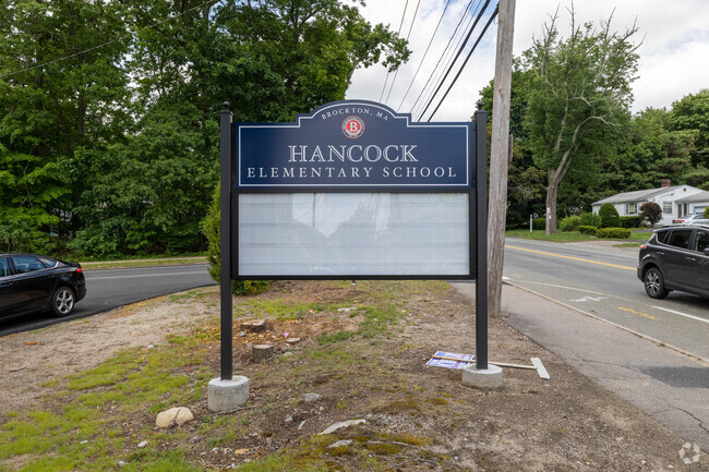A school announcement sign welcomes you to Hancock Elementary School in Brockton.