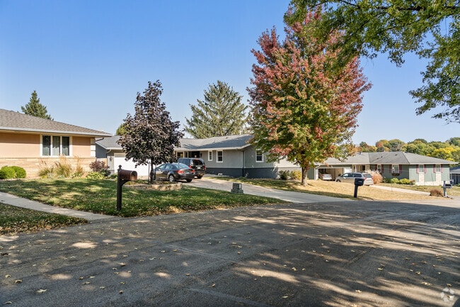 Quiet tree-lined streets and cozy homes make Folwell Drive a peaceful neighborhood gem.