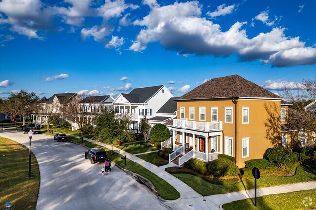 Curving residential streets meet grassy Baldwin Park parkways.