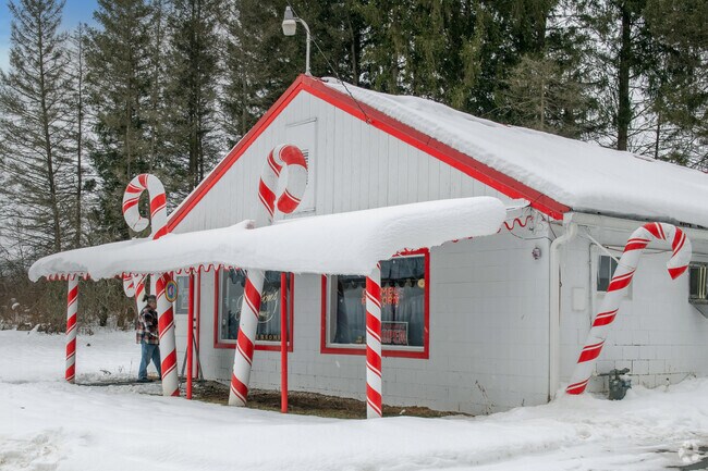 Peterson’s Candies stands out with its iconic candy cane décor and reputation for handcrafted sweets.